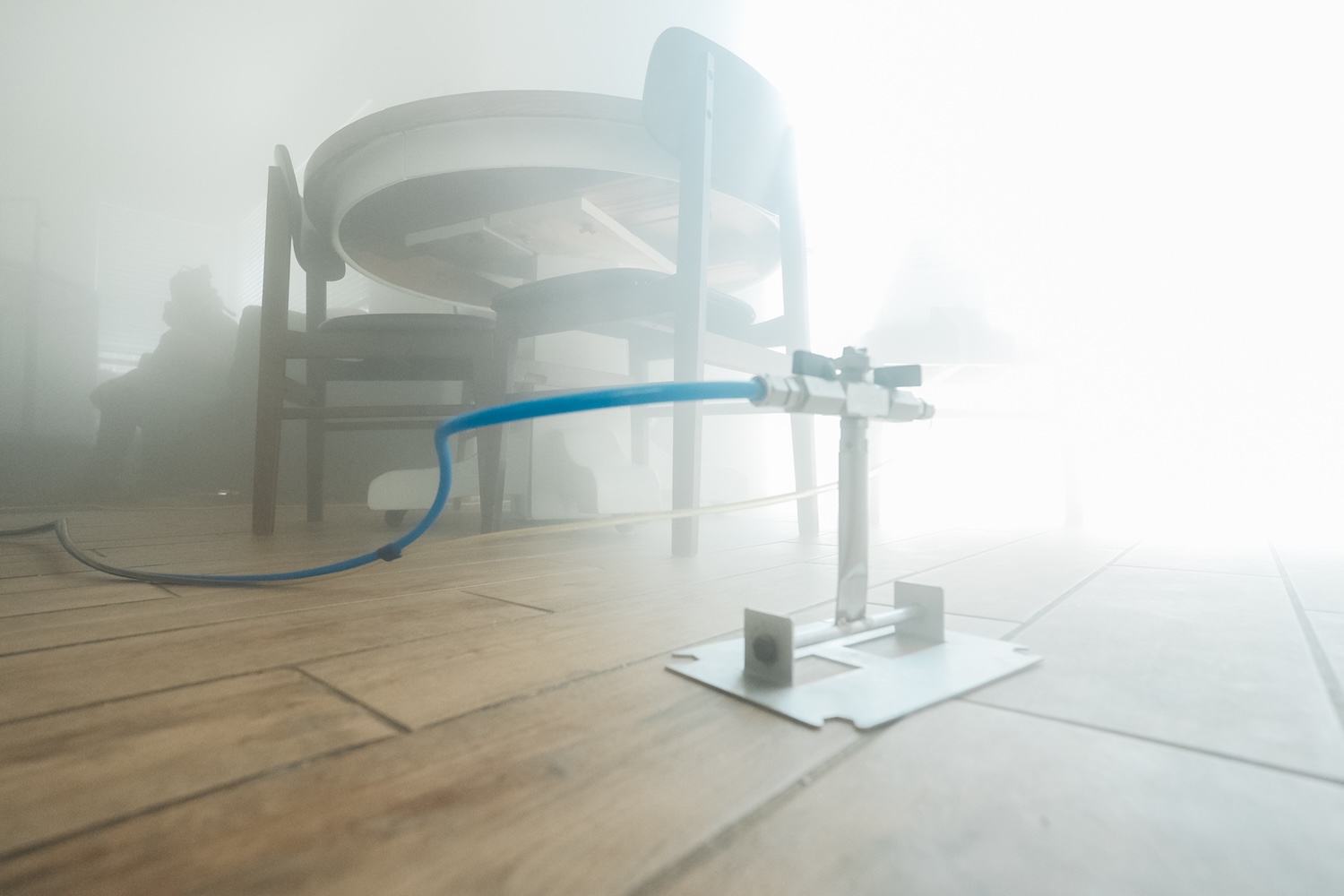 Dry-fog nozzle filling a Fresno dining room with 7-micron fog